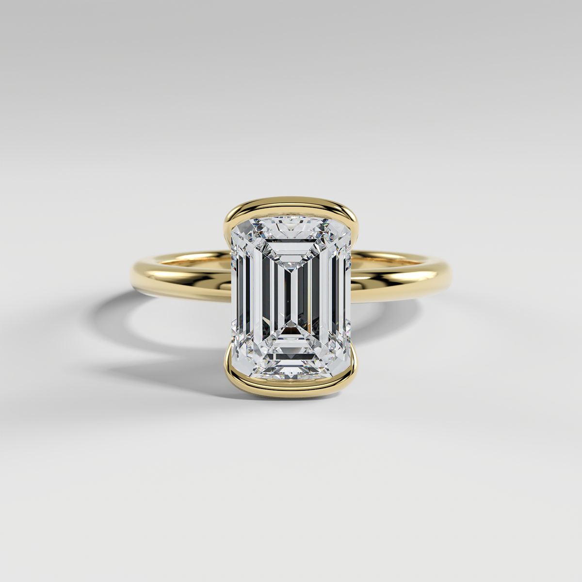 POPPY - Emerald Solitaire Engagement Ring with Half Bezel Setting and Polished Band