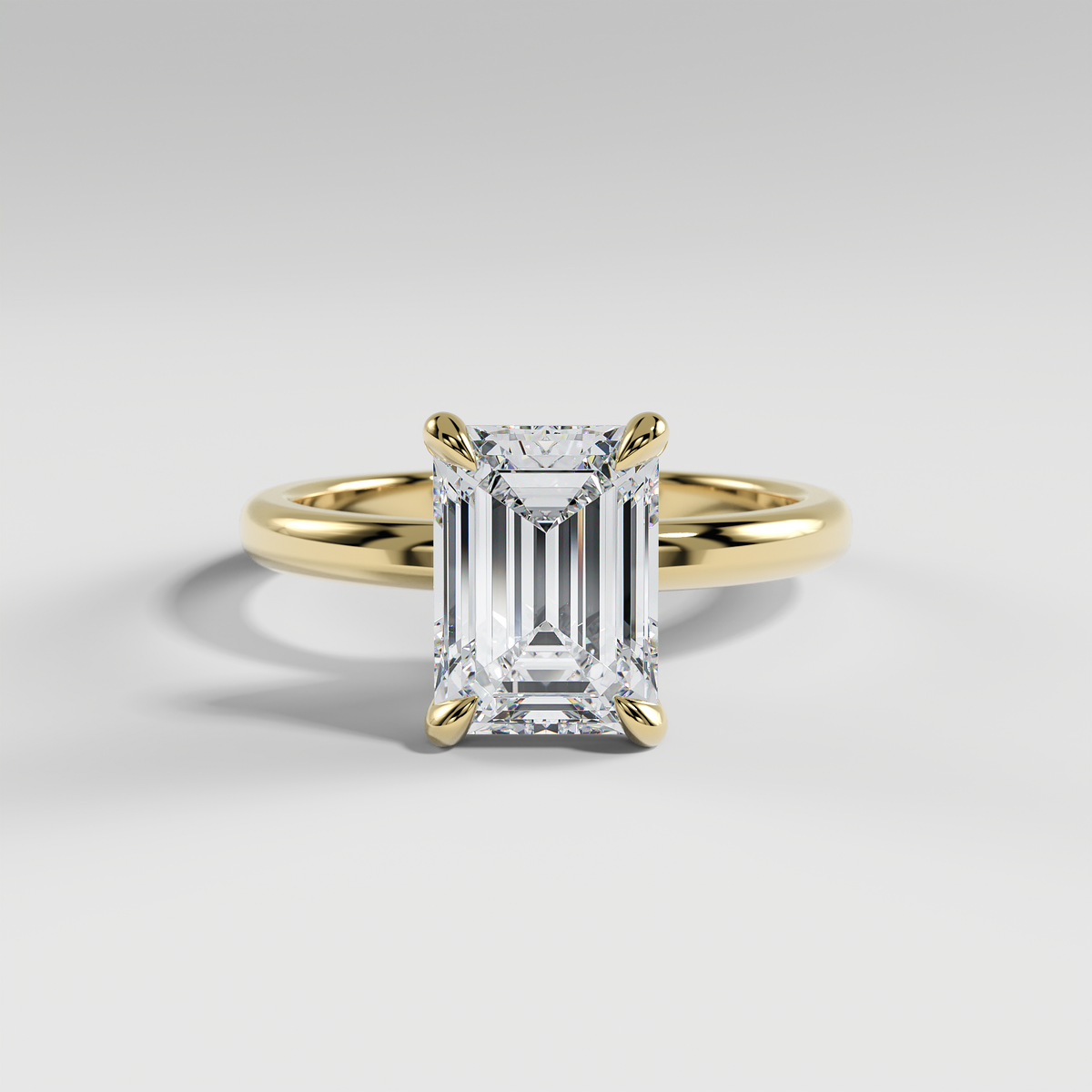 ARIANA - Emerald Solitaire Engagement Ring with Polished Band and Open Basket Setting