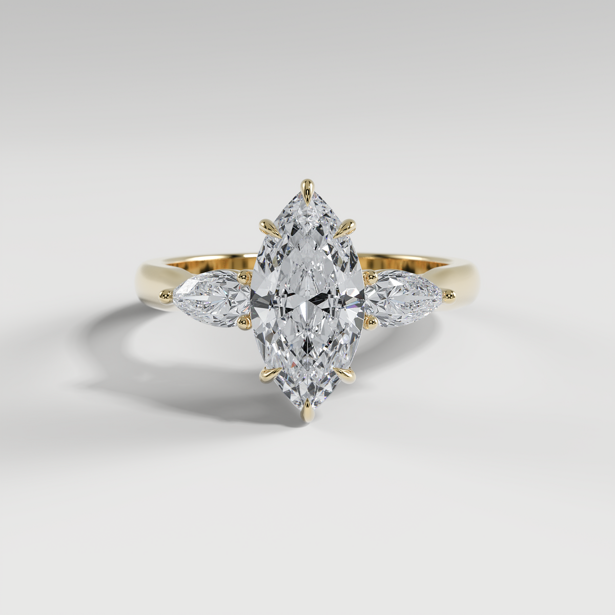 HAZEL - Marquise Three-Stone Engagement Ring with Pear Side Stones and Polished Cathedral Band
