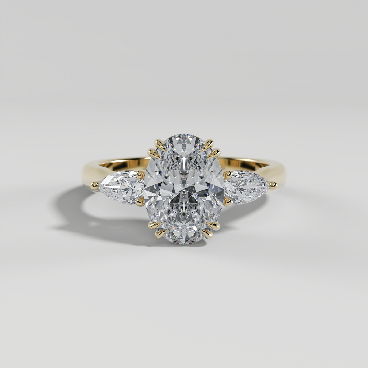 HAZEL - Oval Three-Stone Engagement Ring with Pear Side Stones and Polished Cathedral Band