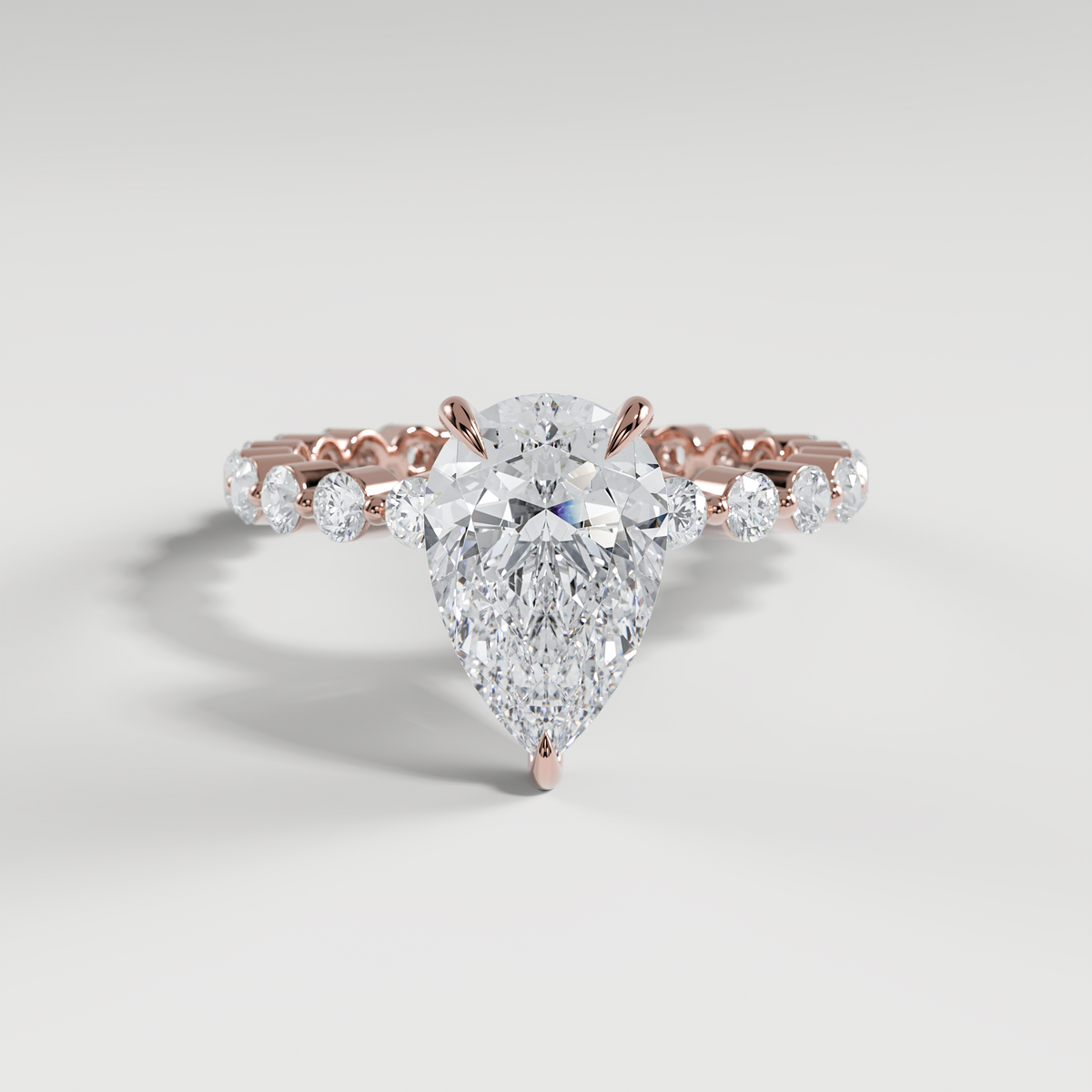 CHLOE - Pear Solitaire Engagement Ring with 2.2mm Round Accent Diamonds