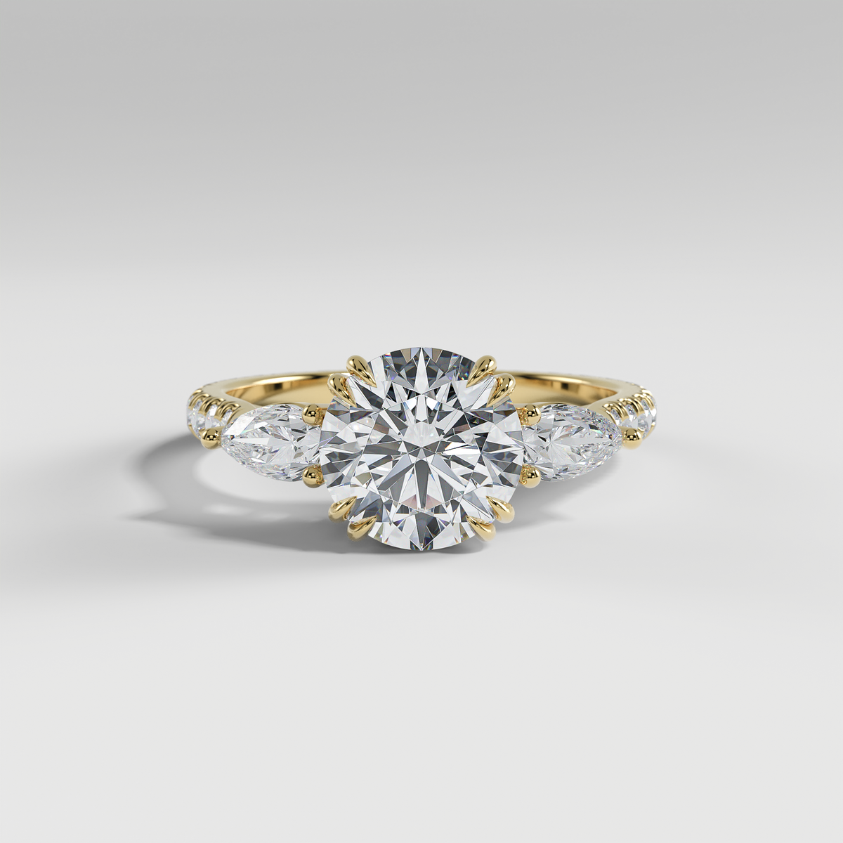 ISLA - Round Three-Stone Engagement Ring with Pear Side Stones and Pavé Cathedral Band