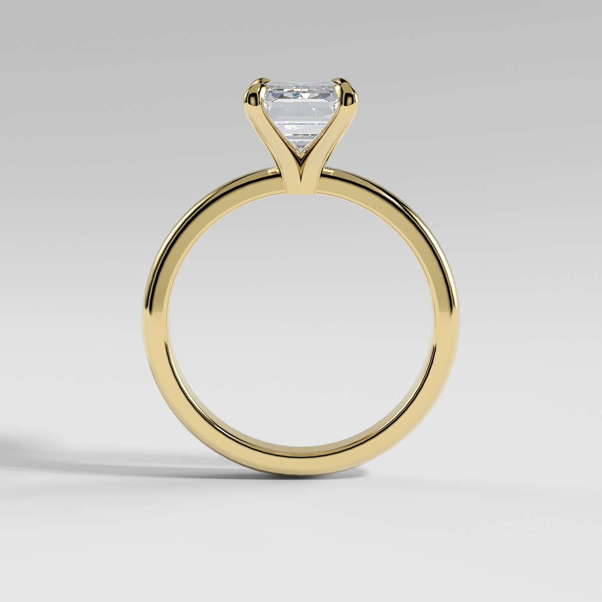 ARIANA - Emerald Solitaire Engagement Ring with Polished Band and Open Basket Setting