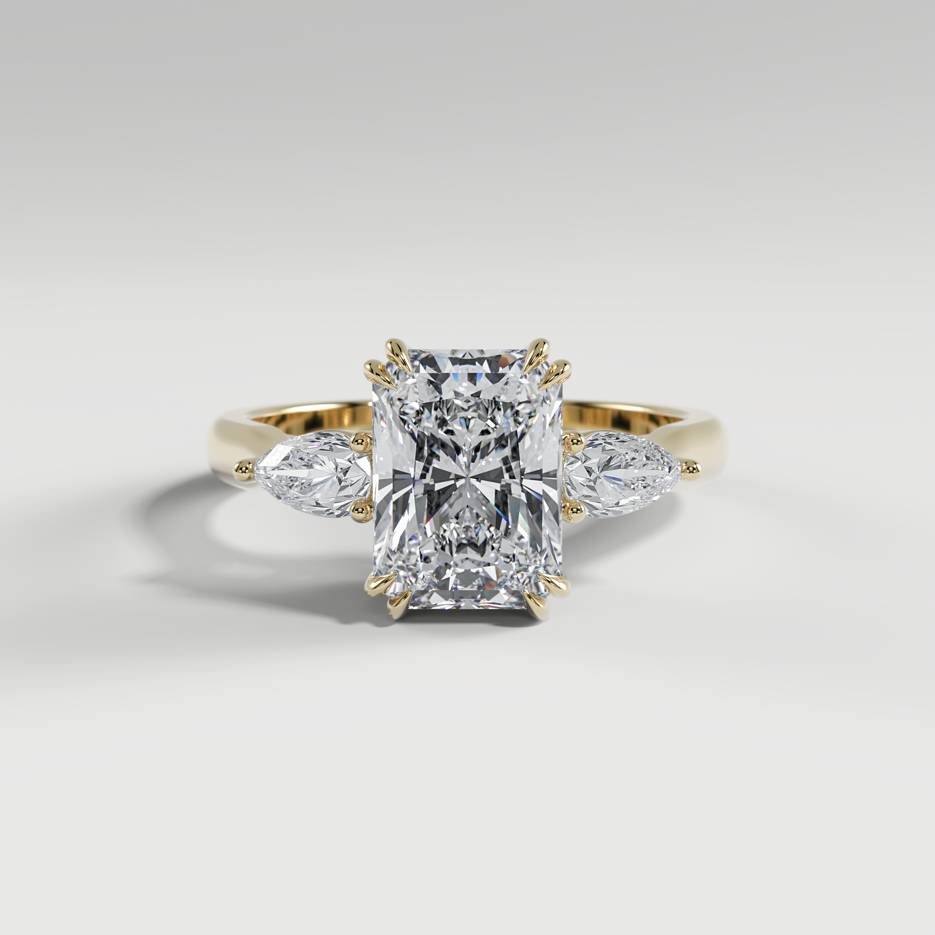 HAZEL - Radiant Three-Stone Engagement Ring with Pear Side Stones and Polished Cathedral Band